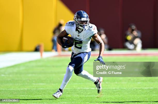 Robert Woods of the Tennessee Titans runs with the ball against the Washington Commanders at FedExField on October 09, 2022 in Landover, Maryland.