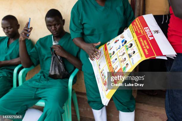 Red Cross volunteers prepare to distribute community awareness posters informing about Ebola on October 13, 2022 in Mubende, Uganda. Emergency...