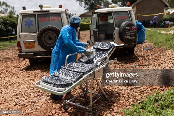 Red Cross workers clean ambulances prior to transporting Ebola victims to a hospital on October 13, 2022 in Mubende, Uganda. Emergency response...