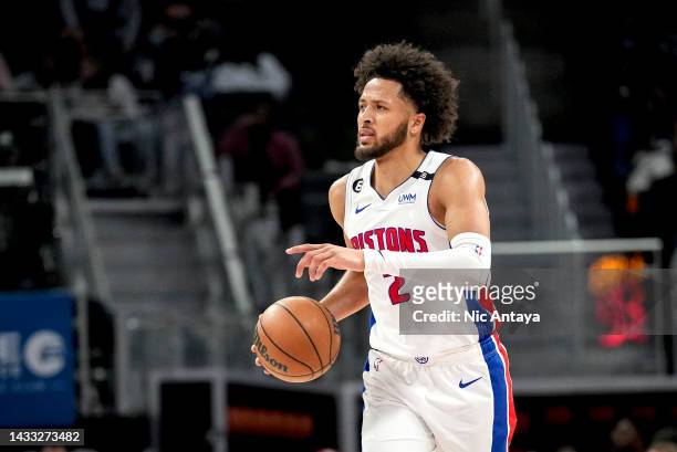 Cade Cunningham of the Detroit Pistons handles the ball against the Memphis Grizzlies at Little Caesars Arena on October 13, 2022 in Detroit,...
