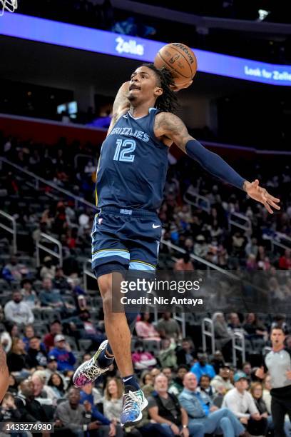 Ja Morant of the Memphis Grizzlies dunks the ball against the Detroit Pistons at Little Caesars Arena on October 13, 2022 in Detroit, Michigan. NOTE...