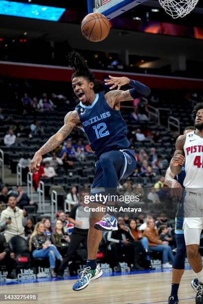 Ja Morant of the Memphis Grizzlies dunks the ball against the Detroit Pistons at Little Caesars Arena on October 13, 2022 in Detroit, Michigan. NOTE...