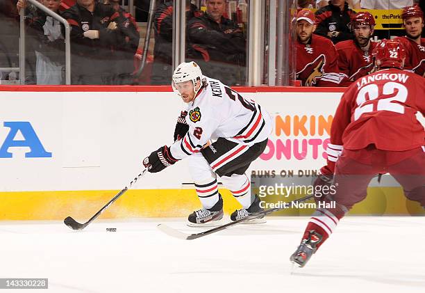 Duncan Keith of the Chicago Blackhawks skates with the puck against the Phoenix Coyotes in Game Five of the Western Conference Quarterfinals during...