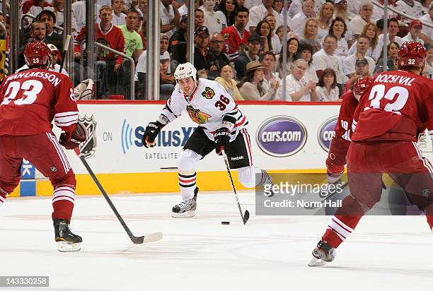 Dave Bolland of the Chicago Blackhawks skates the puck up ice against the Phoenix Coyotes in Game Five of the Western Conference Quarterfinals during...