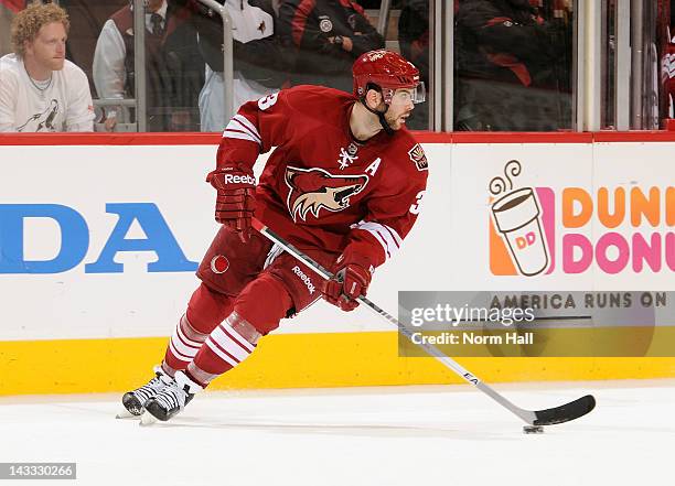 Keith Yandle of the Phoenix Coyotes skates with the puck against the Chicago Blackhawks in Game Five of the Western Conference Quarterfinals during...