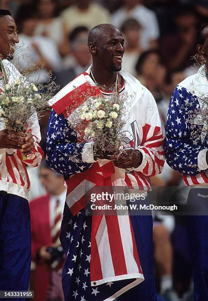Summer Olympics: USA Michael Jordan victorious with gold medal, national flag and floral bouquet after winning Men's Gold Medal Game vs Croatia at...