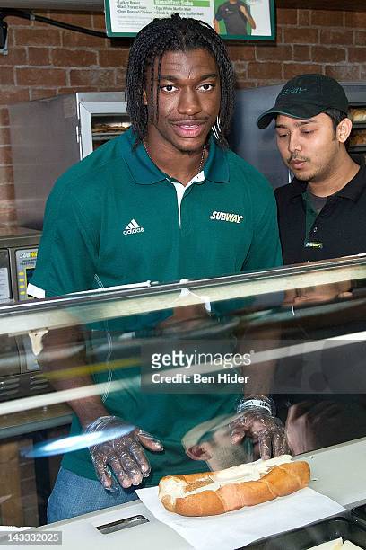 Draft Football player Robert Griffin III aka RG3 attends the unveiling of the Smokehouse BBQ Chicken statue at Subway Restaurant on April 24, 2012 in...