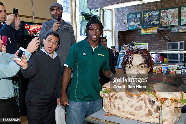 Draft Football player Robert Griffin III aka RG3 attends the unveiling of the Smokehouse BBQ Chicken statue at Subway Restaurant on April 24, 2012 in...