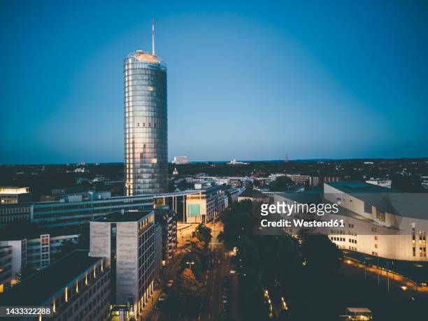 famous tower and aalto theater in essen at dusk - theater scenery stock-fotos und bilder