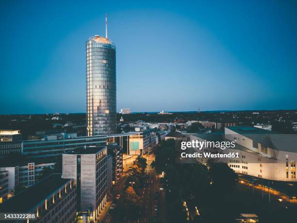 famous tower and aalto theater in essen at dusk - essen ruhrgebiet fotografías e imágenes de stock