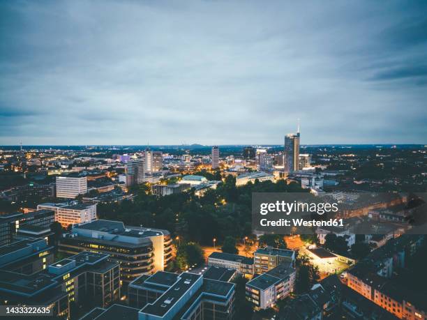 aerial view of city buildings at dusk - essen ruhrgebiet stock-fotos und bilder