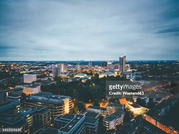 aerial view of city buildings at dusk - essen germany imagens e fotografias de stock