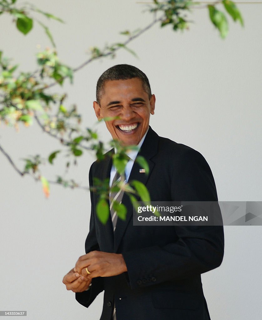 US President Barack Obama walks through