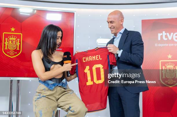 The singer Chanel receives from the president of the Royal Spanish Football Federation, Javier Rubiales, a t-shirt with her name on it during her...