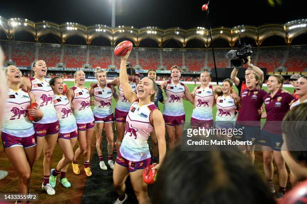 Mikayla Pauga of the Lions sings the team song with team mates after the round eight AFLW match between the Brisbane Lions and the Adelaide Crows at...