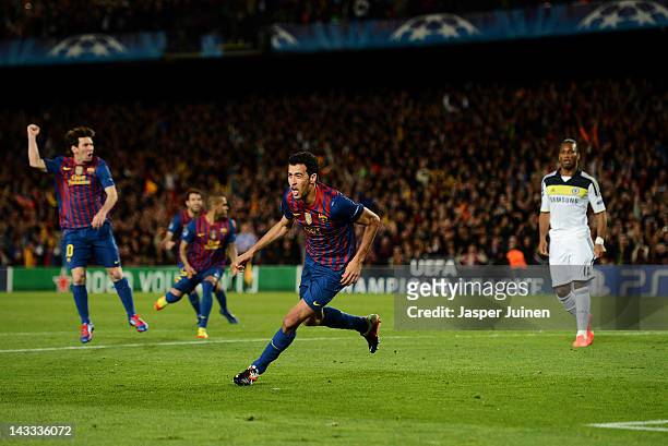 Sergio Busquets of Barcelona celebrates scoring his sides opening goal as Didier Drogba of Chelsea stands dejected during the UEFA Champions League...
