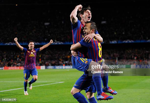 Lionel Messi of FC Barcelona celebrates with his team-mate Andres Iniesta after Iniesta scored their team's second goal during the UEFA Champions...