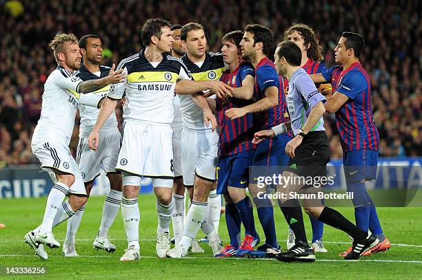 Frank Lampard of Chelsea clashes with Cesc Fabregas of Barcelona during the UEFA Champions League Semi Final, second leg match between FC Barcelona...