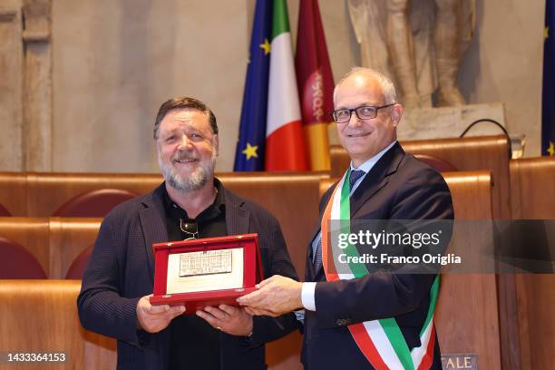 Russell Crowe is awarded with a silver plaque from the Mayor of Rome Roberto Gualtieri as Ambassador Of Rome to the world at Palazzo Senatorio on...