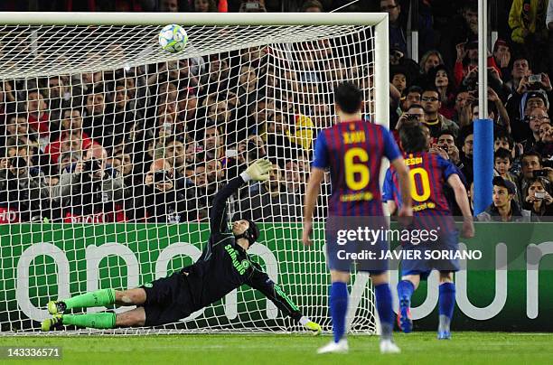 Barcelona's Argentinian forward Lionel Messi misses a penalty shot against Chelsea's Czech goalkeeper Petr Cech during the UEFA Champions League...