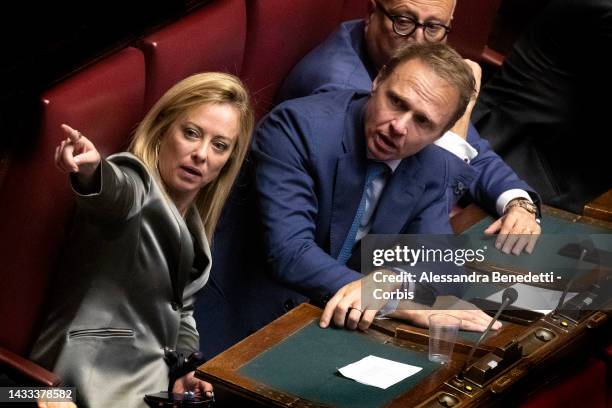Leader of Italian far-right party Brothers of Italy Giorgia Meloni and Francesco Lollobrigida talk during the election of the new President of the...