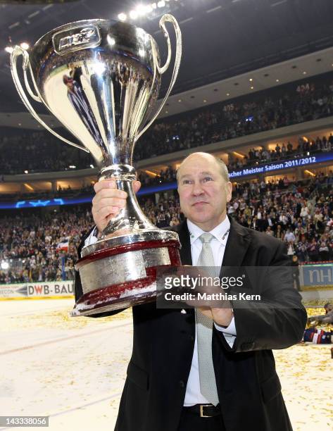 Head coach Don Jackson of Berlin poses with the cup after winning the DEL final match between EHC Eisbaeren Berlin and Adler Mannheim at O2 World...