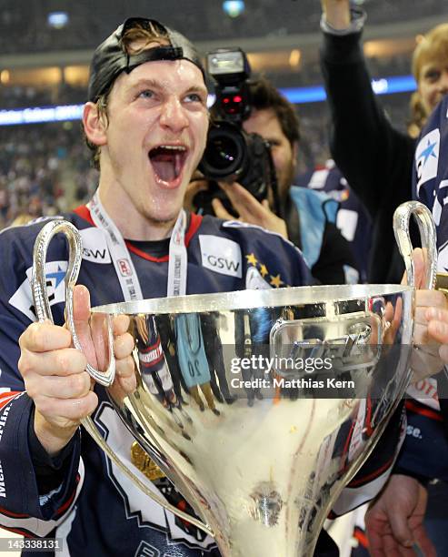 Laurin Braun of Berlin poses with the cup after winning the DEL final match between EHC Eisbaeren Berlin and Adler Mannheim at O2 World stadium on...