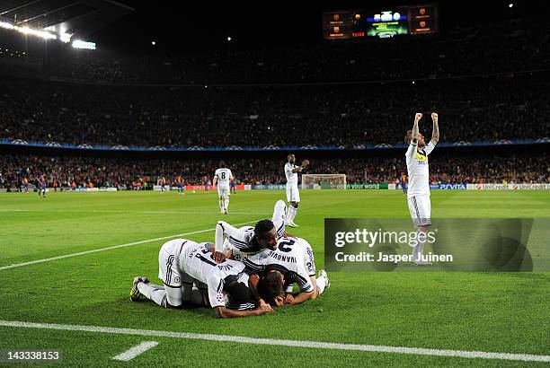 John Obi Mikel , Salomon Kalou and Branislav Ivanovic of Chelsea lay on top of their teammate Fernando Torres celebrating after he scored during the...