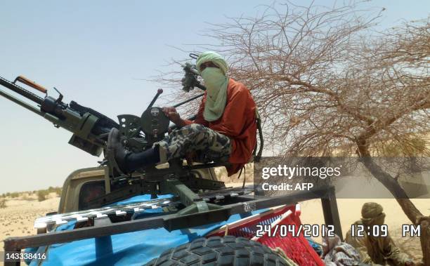 Islamists rebels of Ansar Dine are pictured on April 24, 2012 near Timbuktu, rebel-held northern Mali, during the release of a Swiss hostage. Special...