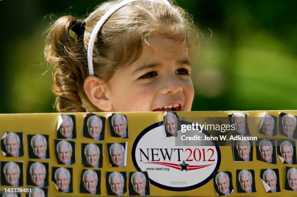 Catalina Salas of Charlotte, N.C. Smiles while waiting for Republican presidential candidate, former Speaker of the House Newt Gingrich as he toured...