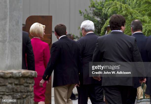 Republican presidential candidate, former Speaker of the House Newt Gingrich walks away after touring the Billy Graham Library with his wife,...