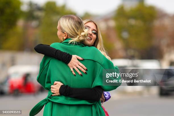 Leonie Hanne and Emili Sindlev are seen, outside Zimmermann, Paris Fashion Week - Womenswear Spring/Summer 2023, on October 03, 2022 in Paris, France.