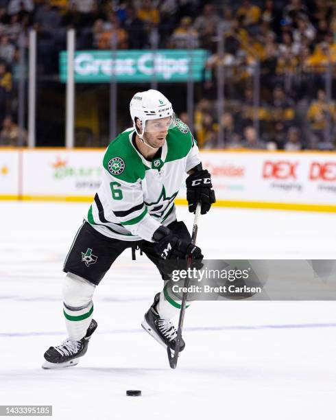 Colin Miller of the Dallas Stars skates the puck against the Nashville Predators during the second period at Bridgestone Arena on October 13, 2022 in...