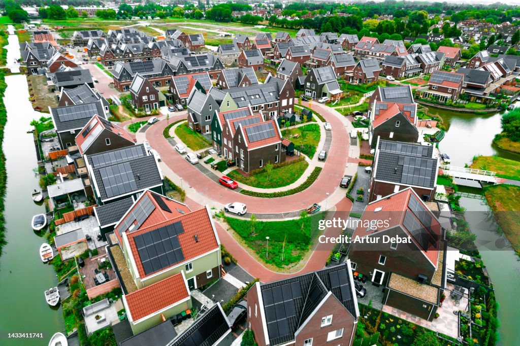 Aerial view above sustainable neighborhood with full solar panels in the Netherlands.