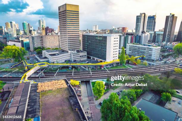 aerial view of the rotterdam skyline with the yellow luchtsingel footbridge. - rotterdam station stock-fotos und bilder