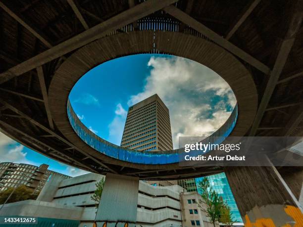 the rotterdam luchtsingel from below with hole and the city skyline. - rotterdam skyline stock pictures, royalty-free photos & images