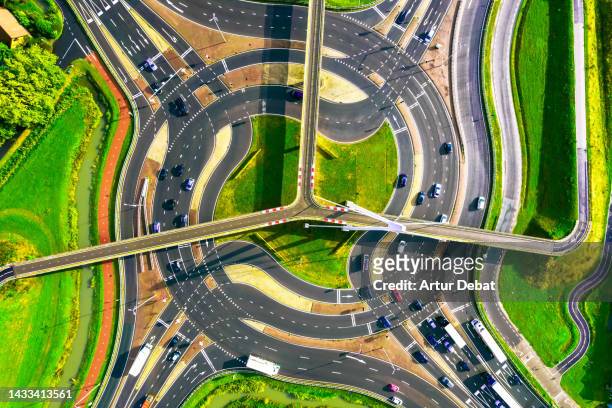 directly above view of the snelbinder turbo roundabout in the netherlands with urban intersection. - crossroad top view stock pictures, royalty-free photos & images