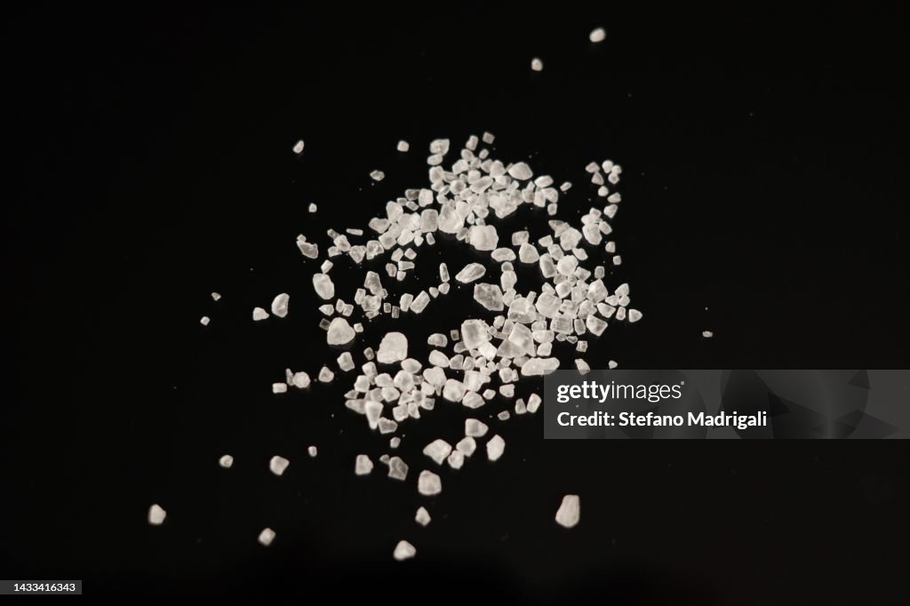 Salt grains on a black background