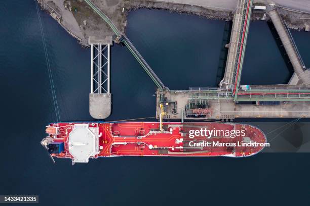 aerial view of an oil tanker at an oil port - olietanker stockfoto's en -beelden
