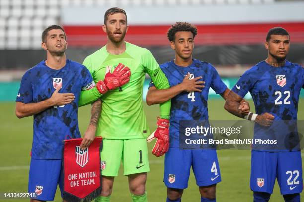 Christian Pulisic, Matt Turner, Tyler Adams and DeAndre Yedlin of the United States stand during the National anthem during a game between Saudi...