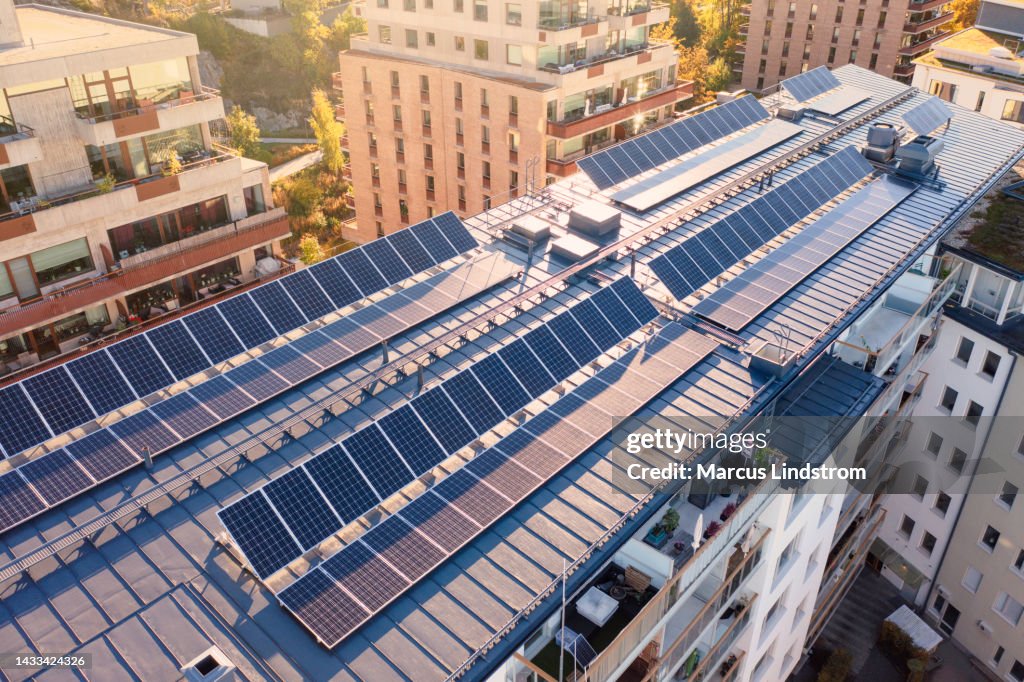 Solar panels on the roof of an apartment building