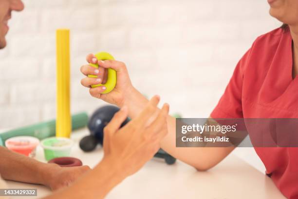 female physiotherapist is examining to her patient. - karpaltunnelsyndrom bildbanksfoton och bilder