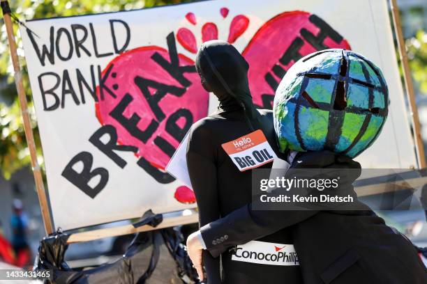 Climate activists rally against the use of fossil fuels outside of the World Bank Headquarters on October 14, 2022 in Washington, DC. The group of...