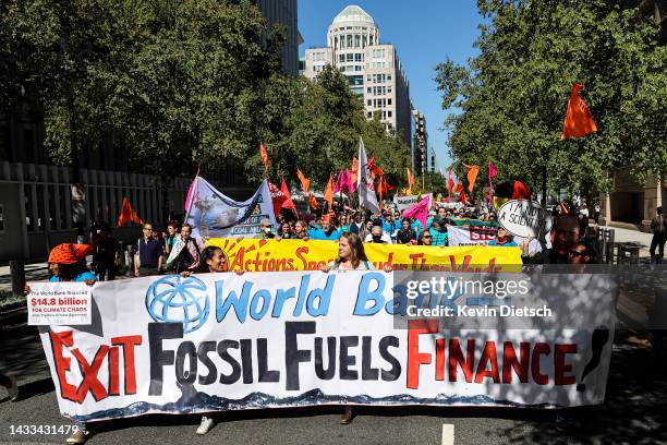 Climate activists rally against the use of fossil fuels outside of the World Bank Headquarters on October 14, 2022 in Washington, DC. The group of...