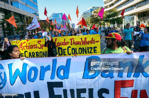 Climate activists rally against the use of fossil fuels outside of the World Bank Headquarters on October 14, 2022 in Washington, DC. The group of...