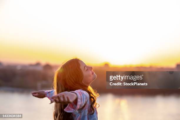 the teenage girl raises her hands - cute teens stock pictures, royalty-free photos & images