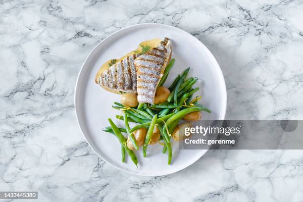 fish dish on marble table top - marble table top view stock pictures, royalty-free photos & images