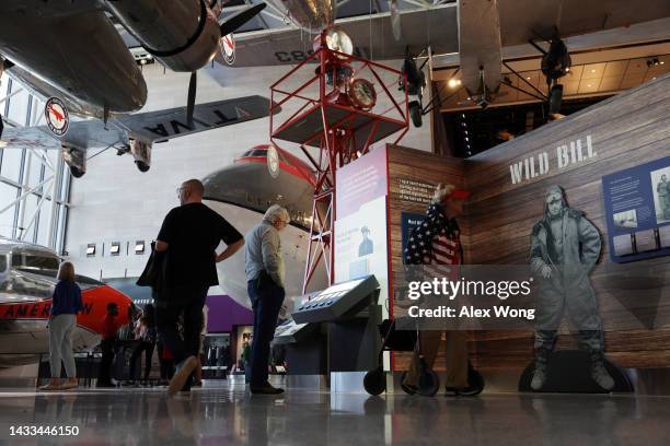 Visitors browse exhibit at The Smithsonian National Air and Space Museum on its reopening on October 14, 2022 in Washington, DC. The museum reopened...