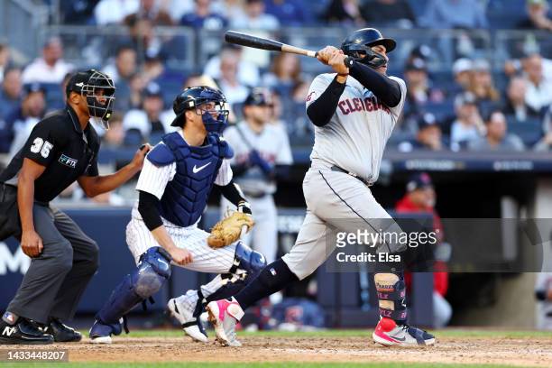 Josh Naylor of the Cleveland Guardians hits a one-run RBI double during the tenth inning against the New York Yankees in game two of the American...