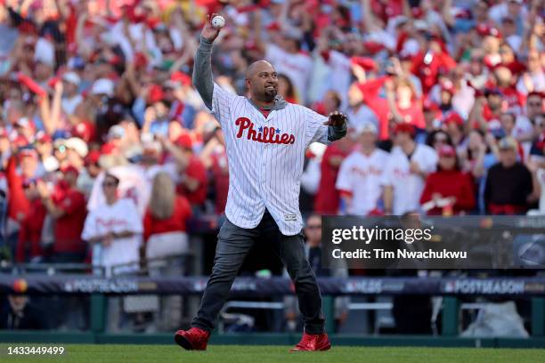 Former Philadelphia Phillies Shane Victorino waves to the crowd before throwing out the first pitch prior to game three of the National League...